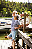 Senior couple resting at lakeside