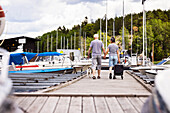 Senior couple walking on pier