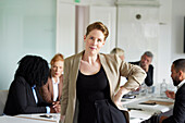 Smiling businesswoman in boardroom