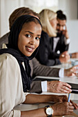 Young woman at business meeting