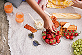 Women eating picnic food