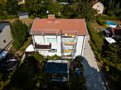Aerial view of house with scaffolding