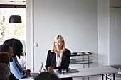 Smiling businesswoman at meeting