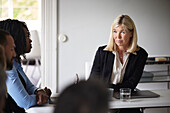 Smiling businesswoman at meeting