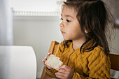 Girl at the table looking away