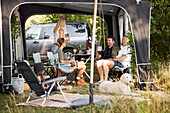 Family relaxing at camping site