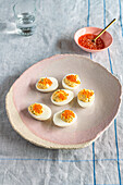 Deviled eggs topped with caviar