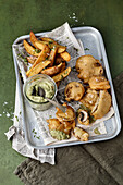 Deep-fried mushrooms with potato wedges and roasted leek spread
