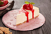 Baked cheesecake with strawberry sauce