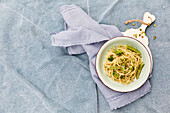 Spaghetti with broccoli pesto and pea pods