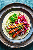 Tempeh tortilla with guacamole and red cabbage