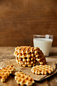 Mini waffles with a glass of milk in the background