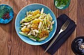 Penne with spring onions and oranges
