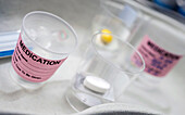Medication in glasses, conceptual image