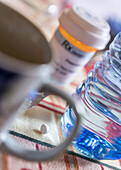 Medication next to a glass of water, conceptual image