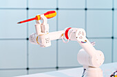 Robotic arm holding screwdriver