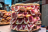 Pile of jamon serrano sandwiches