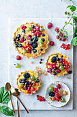 Tarts with lemon curd and berries