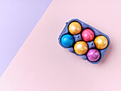 Flat lay with colored easter eggs on bright background