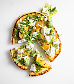 Flat bread topped with basil pesto, grilled peaches, burrata cheese and rocket