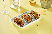 Chicken tacos on a yellow background