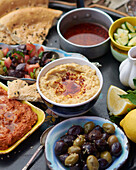 Appetizers of hummus and olives