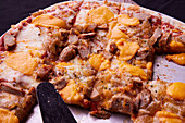 Pizza with sausage, onions and cheese