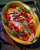 Sea bream with onions and peppers