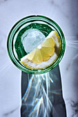 Glass of ice water with lemon
