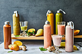 Healthy smoothies in glasses and bottles