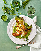 Chicken on green pea hummus with grilled romaine hearts