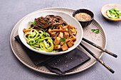 Soba noodles with tofu and mushrooms with cucumber salad