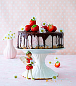 Dripping strawberry ice cream cake
