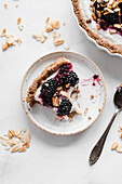 Mascarpone tart with blackberries and almond flakes