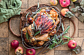 Roast chicken with ham, sage and apples