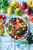 Colourful tomato and raspberry salad with mozzarella