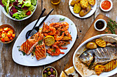 Grilled fish and shrimp with side dishes