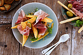 Prosciutto with melon and basil