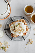 Buckwheat waffles with coconut cream and white currants