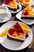 Summer cake with cream cheese and fruit in jelly