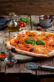 Pizza with sausage and basil