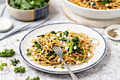 Spaghetti with kale, dill, spring onions and feta