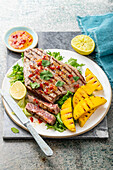 Grilled tuna steak with mango, sweet chili sauce and cilantro