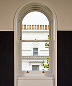 View through arched window to neighbouring building