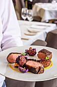Roast duck breast with roasted chanterelles, red cabbage, carrot puree and blueberry sauce