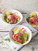 Potato pastrami salad with red onions and radishes