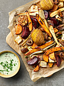 Colorful oven roasted vegetables with herb dip