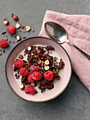 Quick pan granola with almond milk, nuts and raspberries