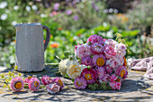 Bouquet with roses and strawflowers