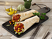 Tortillas with bolognese, corn and jalapenos